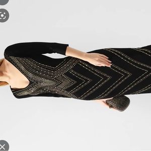 St. John Couture. 3/4 sleeves and slit up the back. Formal or evening wear.